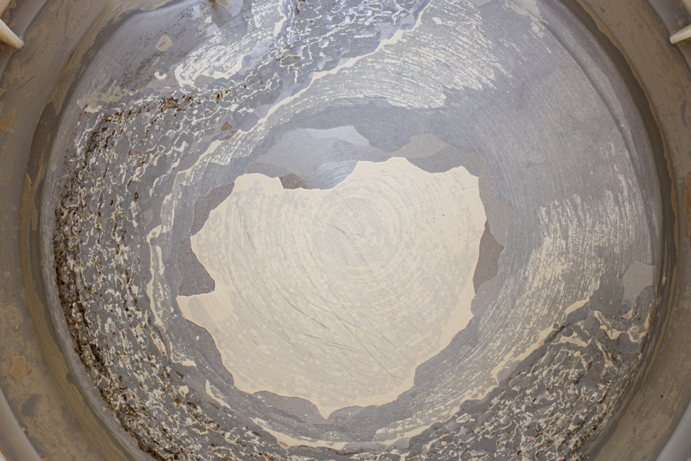 Limescale deposit at the bottom of a tank