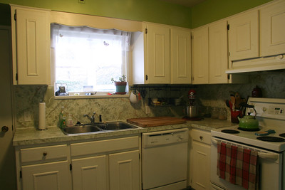 white cabinets with granite worktops