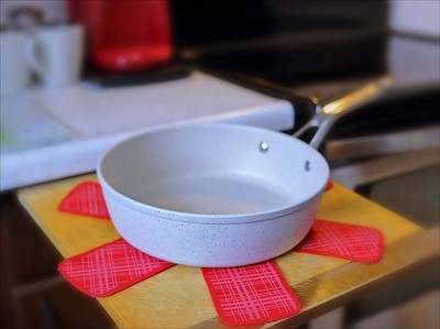 a white-coated cookware in the kitchen