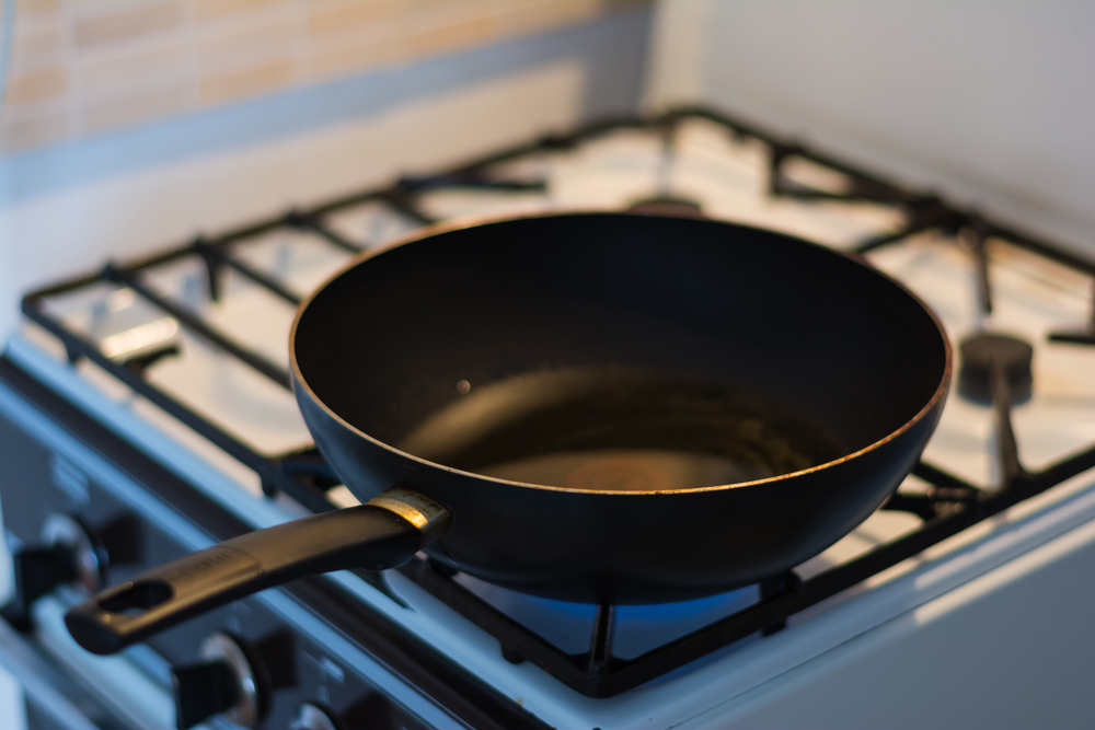closeup of a black pan on a stove