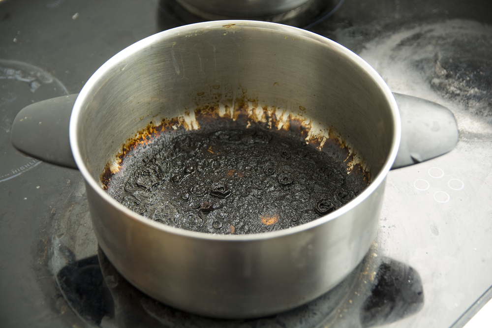 how to remove burnt milk from a pan