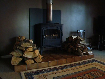 some logs with wood burner in living room